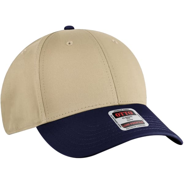 A beige and navy 6 panel low profile baseball cap with a branding label on the front.