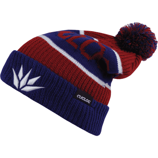 A beanie in red, blue, and white featuring a pom-pom on top and a logo on the side.