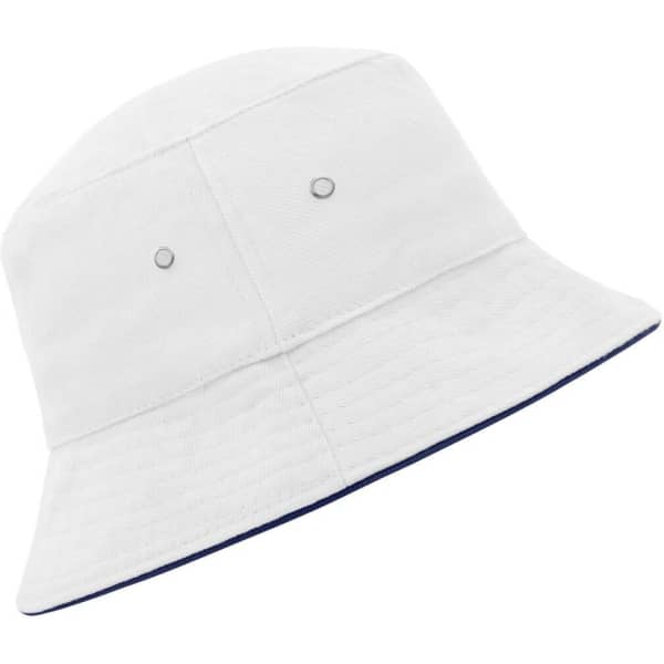A white bucket hat featuring a brim and an inner lining in navy, complete with metal eyelets and a logo.
