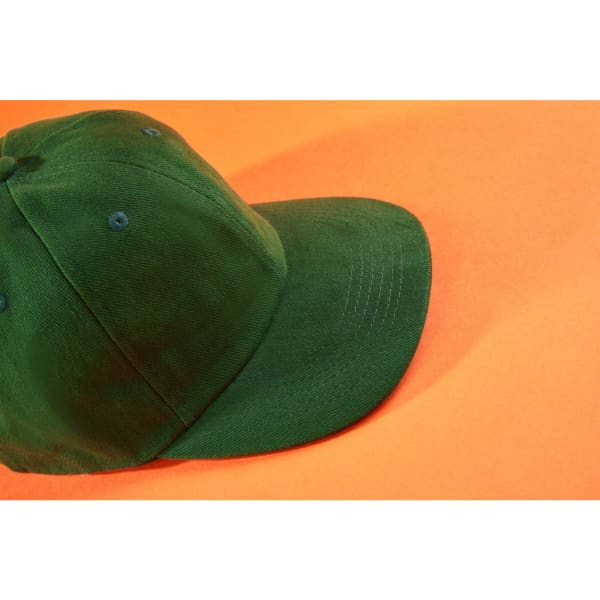 A low-profile 6-panel cap in dark green, featuring a curved brim and a logo on the front.