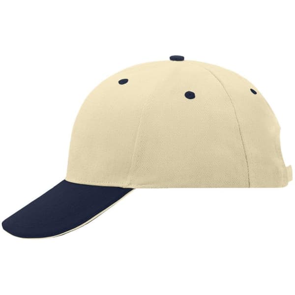 A beige and navy 6-panel sandwich cap featuring a logo on the side and ventilation holes on the top.