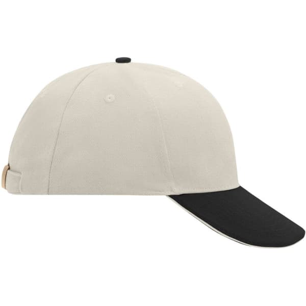 A beige 6-panel sandwich cap with a black peak and an adjustable strap at the back. It features a small logo.