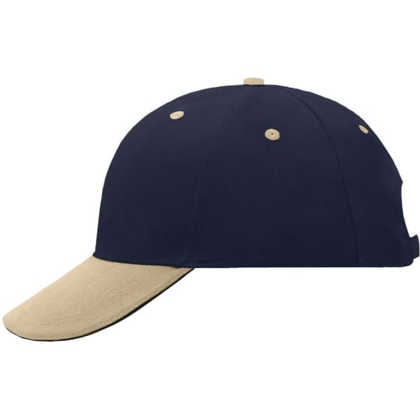 A navy blue 6 panel sandwich cap with a beige peak and contrasting stitching. Features a logo on the side.