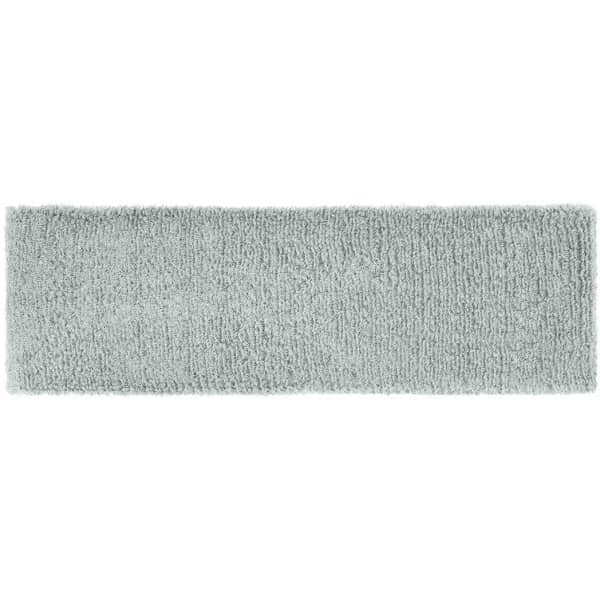 A soft, terry cloth headband in a light grey colour with a textured surface and a logo.