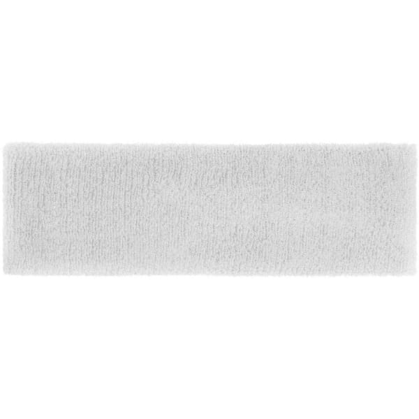A soft, terry headband in white, featuring a smooth texture and a simple design. It has a logo on the side.