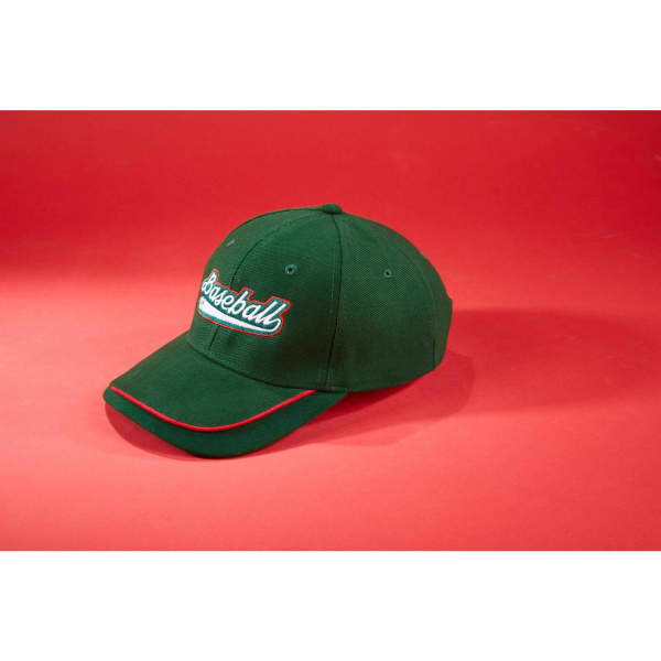 A green cap with a curved peak and a logo, featuring red accents on the brim.