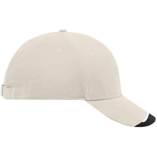 A beige cap with a black peak and a logo on the side, featuring a curved visor and adjustable strap at the back.