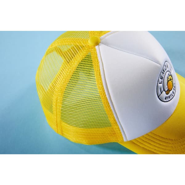 A yellow and white 5 panel polyester mesh trucker cap featuring a round patch and mesh sides.