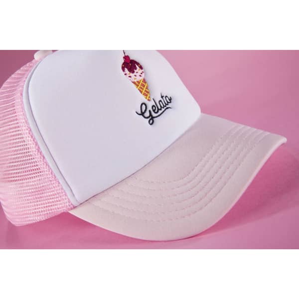 A pink and white trucker cap featuring an ice cream cone embroidery and a mesh back.