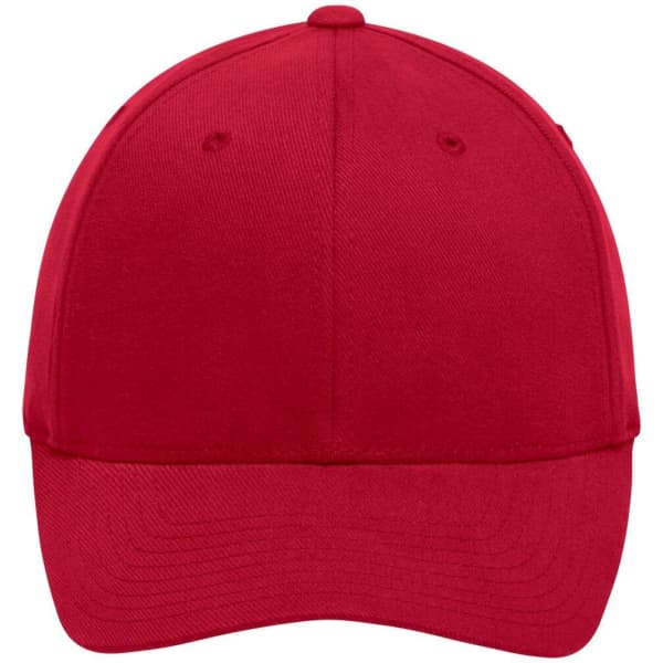 A red original Flexfit® cap with a curved brim and a logo on the front.