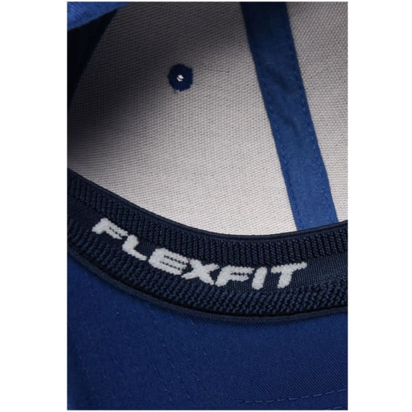 A close-up of a blue Original Flexfit® Cap, featuring an inner band with a logo.