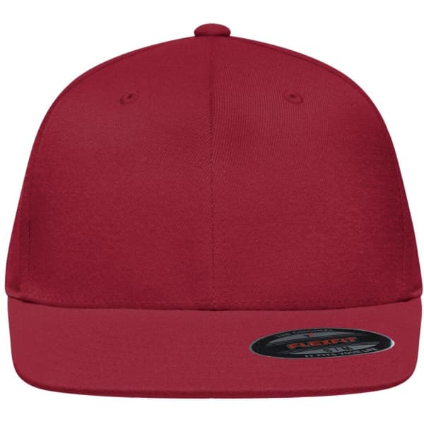 A red Flexfit® flat peak cap featuring a rounded top and a branded label on the inside.