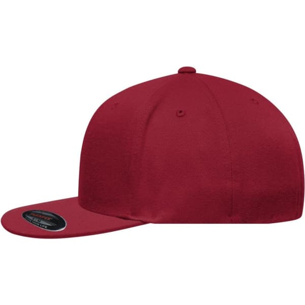 A red Flexfit® Flat Peak Cap with a flat brim and a logo on the side.
