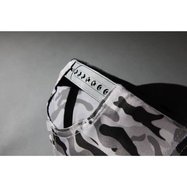 A grey camouflage cap with an adjustable strap at the back, featuring a logo.