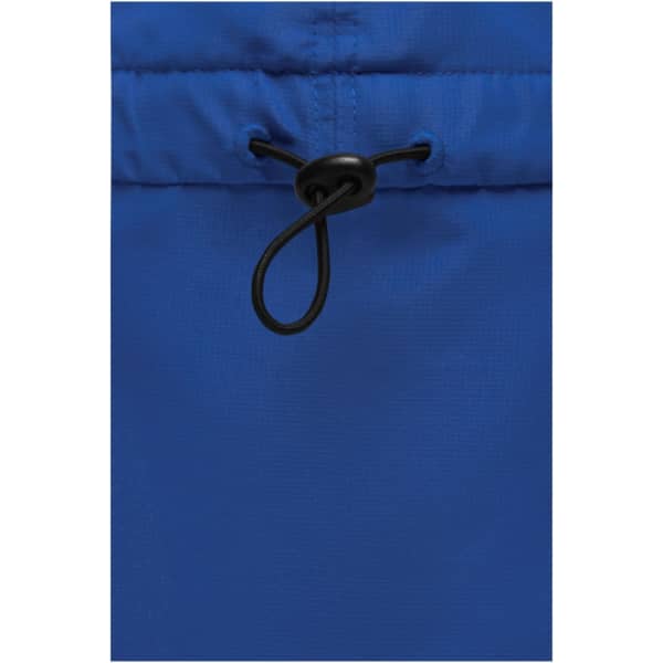 A close-up of the drawstring detail on a vibrant blue garment. The fabric appears smooth and lightweight.