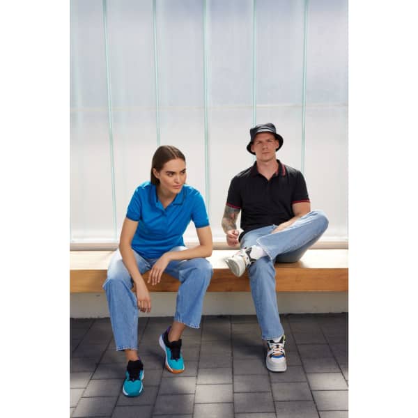 A fisherman hat with a wide brim sits on a person's head, paired with a black polo shirt and denim.