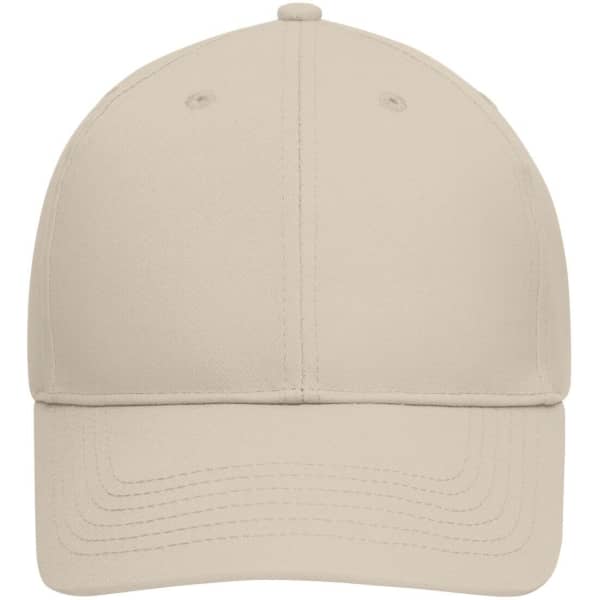 A beige six-panel cap made from bio cotton, featuring a curved visor and a logo on the front.