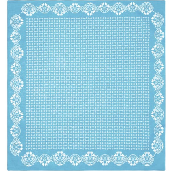 A light blue bandana featuring a white floral pattern along the edges and a polka dot centre.
