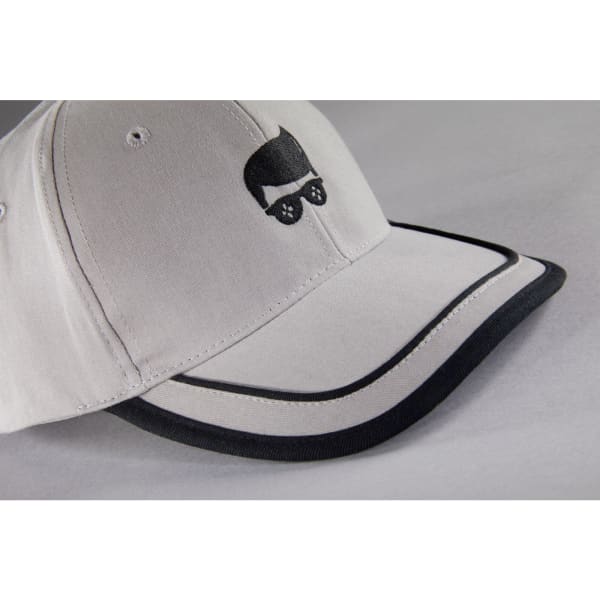 A grey 6 panel piping cap featuring a logo, with a black visor and piping details.