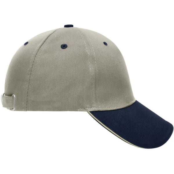 A beige and navy 5 panel sandwich cap featuring a contrasting peak and an adjustable strap at the back.