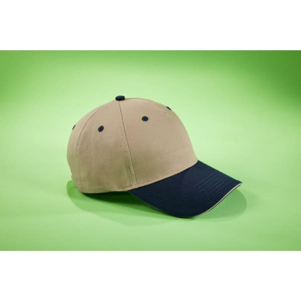 A beige and navy 5 Panel Sandwich Cap with a curved brim and a logo on the front.