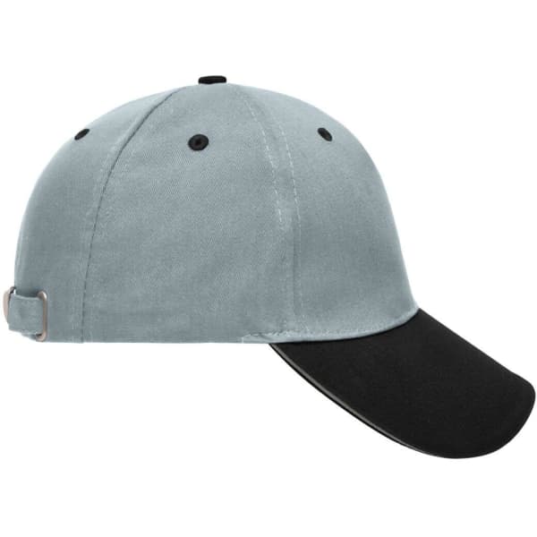 A grey 5 panel sandwich cap with a black peak and an adjustable strap at the back. It features a logo.