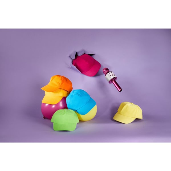 A colourful array of kids' caps in orange, yellow, pink, blue, and green, with a microphone suspended above them.
