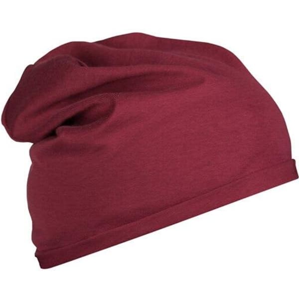 A maroon beanie made from bio cotton, featuring a slouchy design. It has a subtle logo on the side.