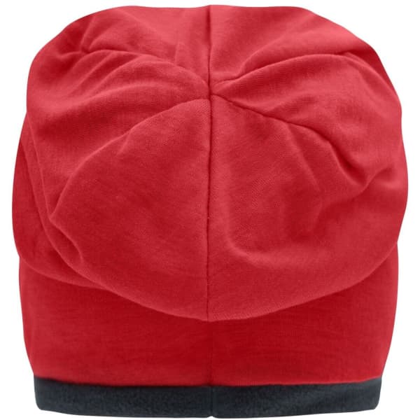 A red fleece beanie featuring a smooth texture and a dark grey band at the bottom. It has a logo on it.