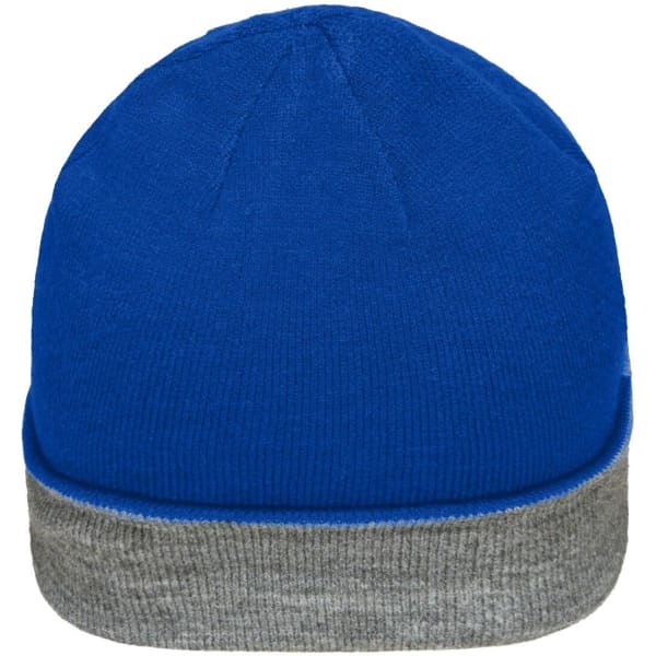 A reversible beanie featuring a blue top and a grey cuff, with a small logo on the side.