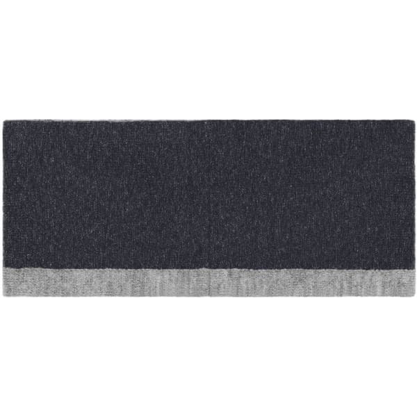 A reversible headband featuring a dark grey design with a lighter grey trim, displaying a simple logo.