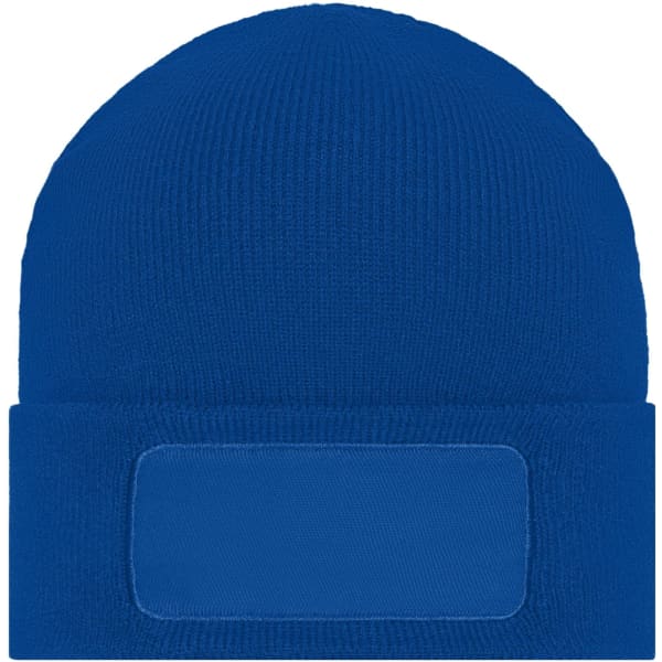 A blue knitted beanie featuring a patch area for custom branding.