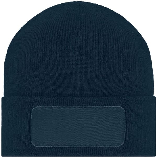 A knitted navy blue beanie featuring a patch area for custom branding or decoration.