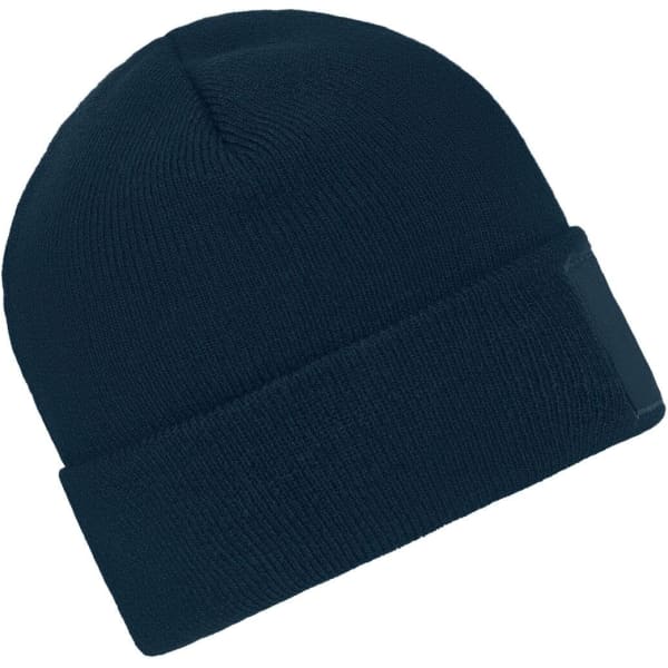 A knitted beanie in navy blue with a patch on the front and a folded cuff.