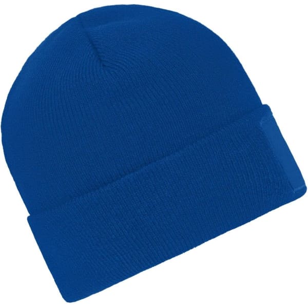 A knitted beanie in bright blue with a cuffed design and a patch on one side.