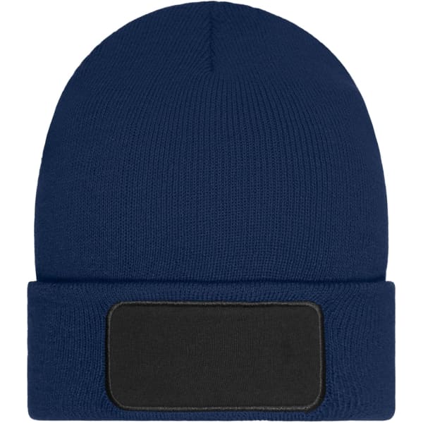 A navy blue beanie with a fold-over cuff and a patch area for branding.