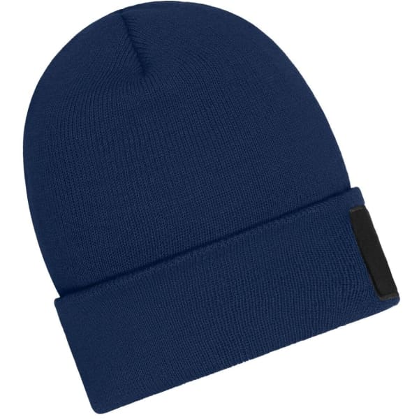 A navy blue beanie with a folded cuff and a patch on the front, made with Thinsulate material.