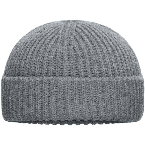 A grey knitted beanie with a ribbed texture and a turned-up cuff. It features a small logo.