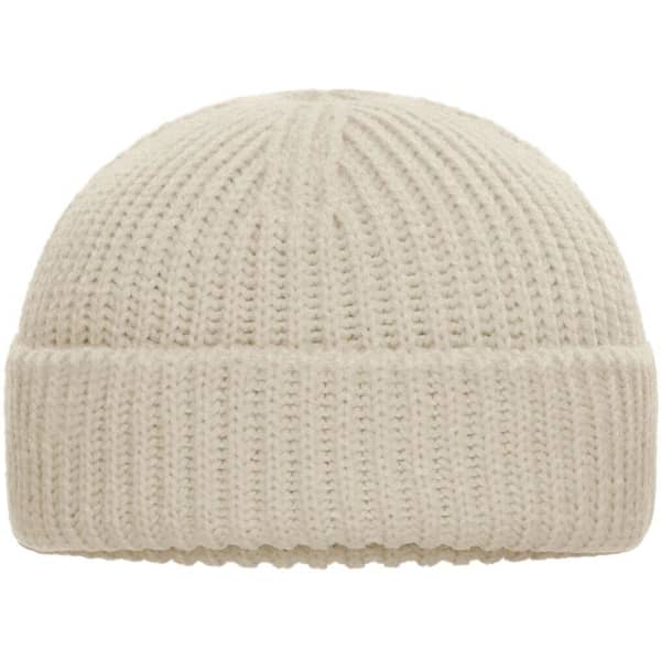 A beige knitted beanie with a ribbed texture and a folded cuff, featuring a logo.