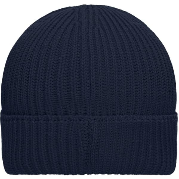 A navy blue knitted beanie with a folded cuff and a logo on the side.
