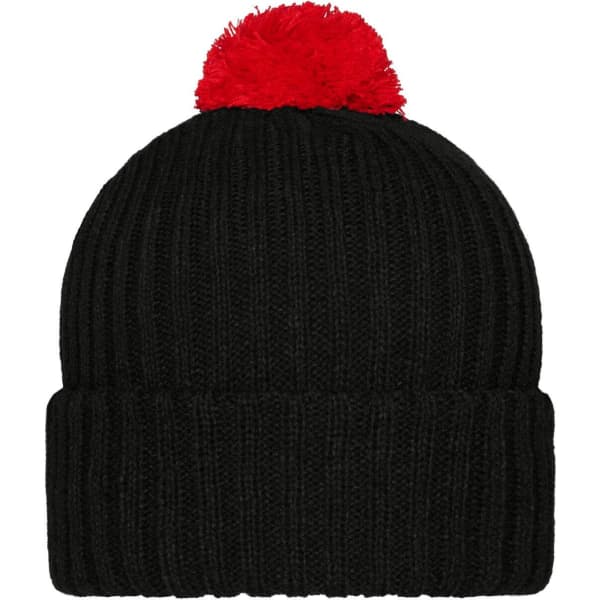 A black knitted beanie with a red pompon on top, featuring a ribbed texture and a folded cuff.