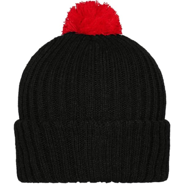 A black knitted beanie with a red pompon on top and a ribbed design. It features a branding logo.