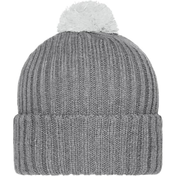 A grey knitted beanie with a white pompon on top and a ribbed texture. It features a small logo on the side.