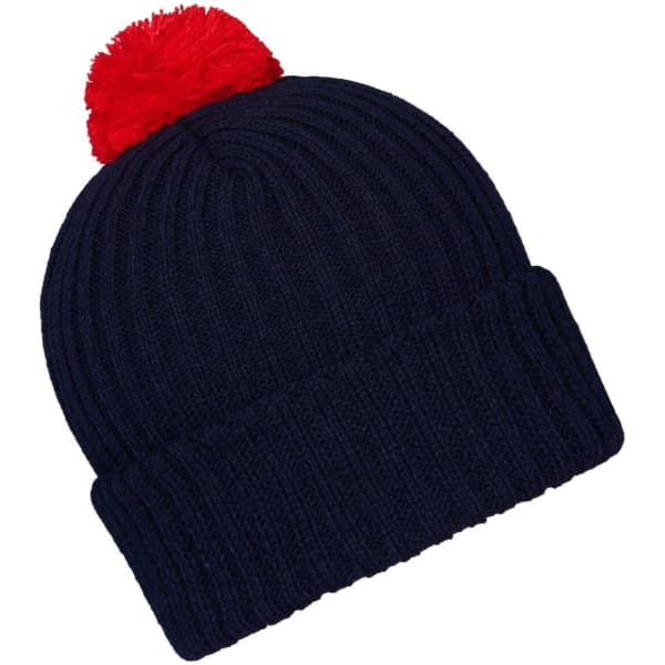 A navy knitted beanie with a red pompon on top, featuring a ribbed design and a folded cuff.