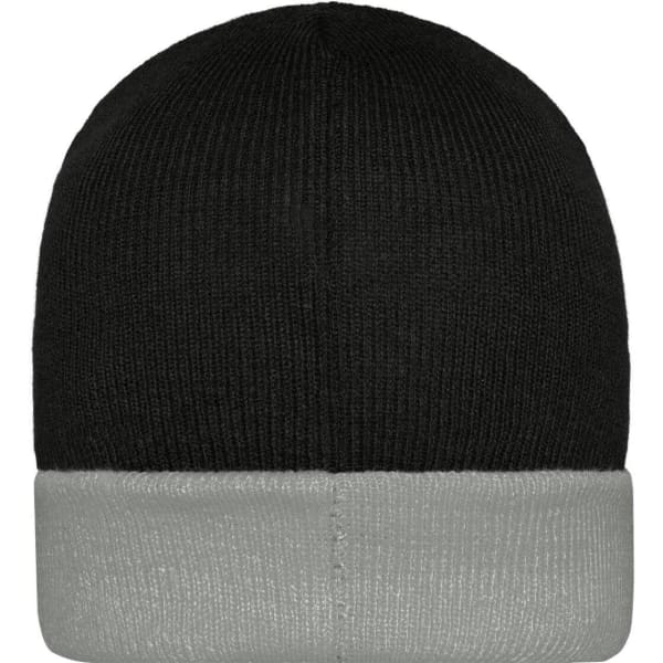 A knitted beanie featuring a black top and a grey cuff, with a logo on the side.