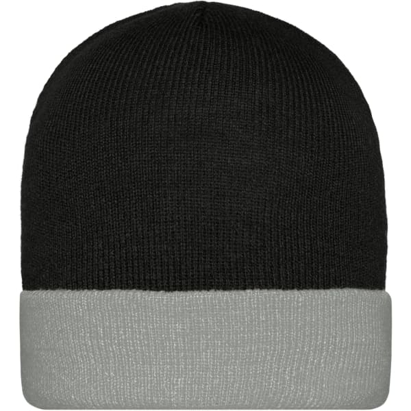 A knitted beanie featuring a black top and a grey fold-up cuff, with a logo on the side.