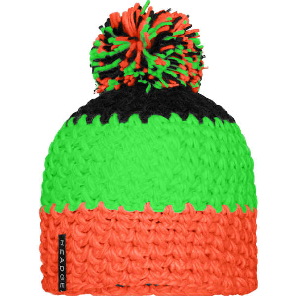 A beanie with a pompon featuring bright green, black, and orange colours, with a logo tag on the side.