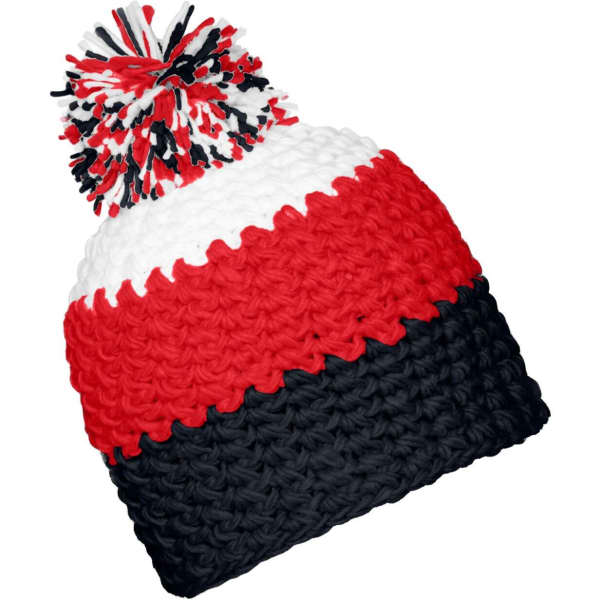 A knitted beanie with a pompon, featuring red, white, and navy blue stripes. It has a textured design and a logo.