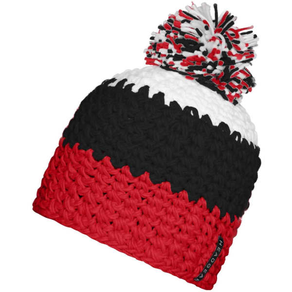 A knitted beanie in red, black, and white with a pompon on top and a logo.