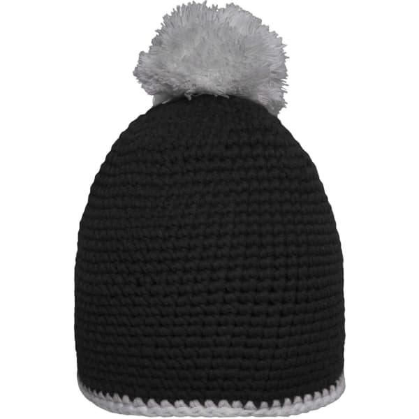 A black beanie with a contrast white stripe and a grey pompon on top. It features a simple crocheted design.